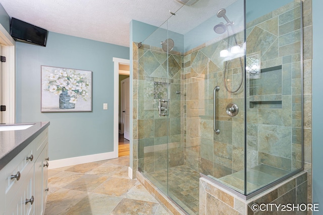 3981 Acadia Dr, Hudsonville, MI 49426 - full bathroom featuring a shower stall, vanity, and a textured ceiling
