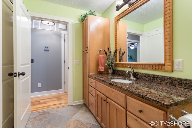 3981 Acadia Dr, Hudsonville, MI 49426 - bathroom with vanity and a textured ceiling