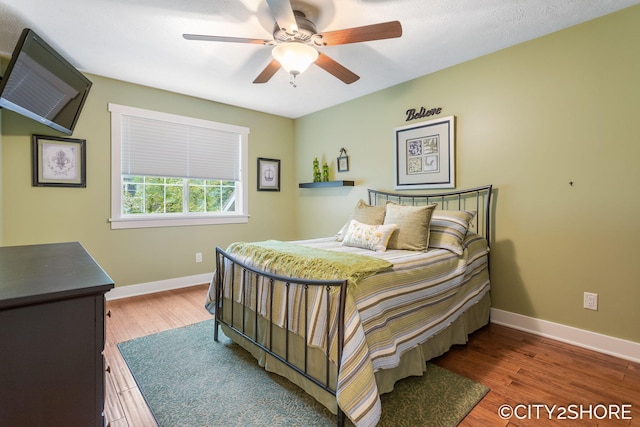 3981 Acadia Dr, Hudsonville, MI 49426 - bedroom featuring wood finished floors and a ceiling fan