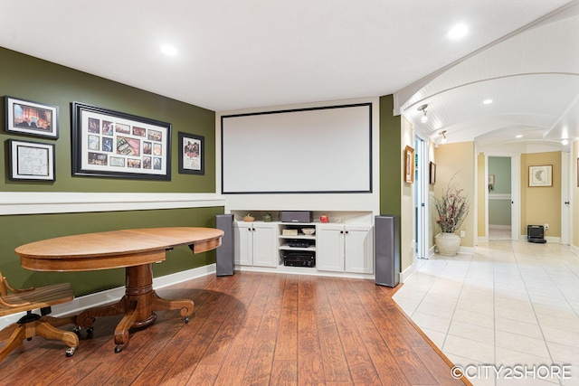 3981 Acadia Dr, Hudsonville, MI 49426 - cinema with arched walkways, hardwood / wood-style flooring, and recessed lighting