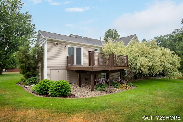3981 Acadia Dr, Hudsonville, MI 49426 - back of property featuring a deck and a yard