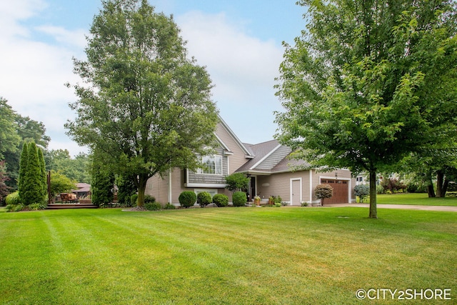 3981 Acadia Dr, Hudsonville, MI 49426 - view of front of property featuring a garage, a front yard, and driveway