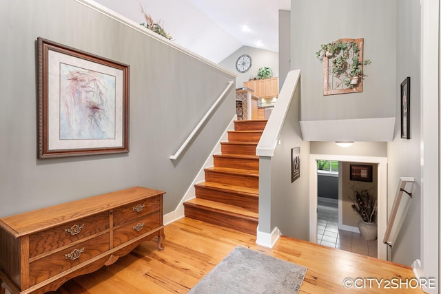 3981 Acadia Dr, Hudsonville, MI 49426 - stairway with vaulted ceiling and wood finished floors