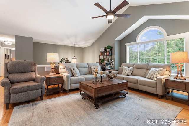 3981 Acadia Dr, Hudsonville, MI 49426 - living area with wood finished floors, a ceiling fan, and high vaulted ceiling