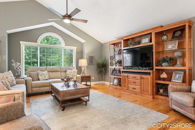 3981 Acadia Dr, Hudsonville, MI 49426 - living room featuring light wood finished floors, a ceiling fan, and lofted ceiling
