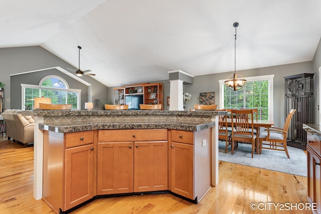 3981 Acadia Dr, Hudsonville, MI 49426 - kitchen with tile countertops, light wood finished floors, and lofted ceiling