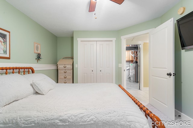 3981 Acadia Dr, Hudsonville, MI 49426 - carpeted bedroom with water heater, a closet, and ceiling fan