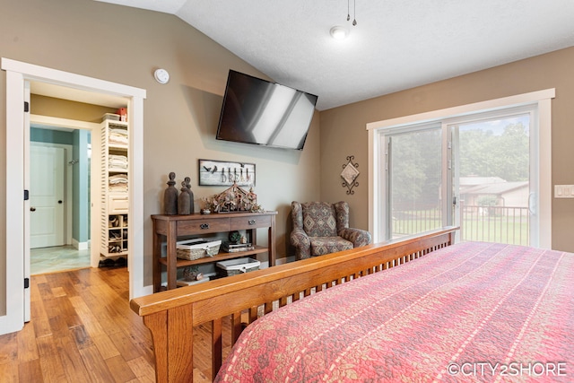 3981 Acadia Dr, Hudsonville, MI 49426 - bedroom featuring access to outside, light wood finished floors, and lofted ceiling
