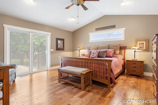 3981 Acadia Dr, Hudsonville, MI 49426 - bedroom with access to exterior, vaulted ceiling, light wood-style floors, and a ceiling fan