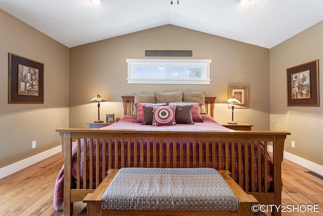 3981 Acadia Dr, Hudsonville, MI 49426 - bedroom featuring light wood-style floors and lofted ceiling