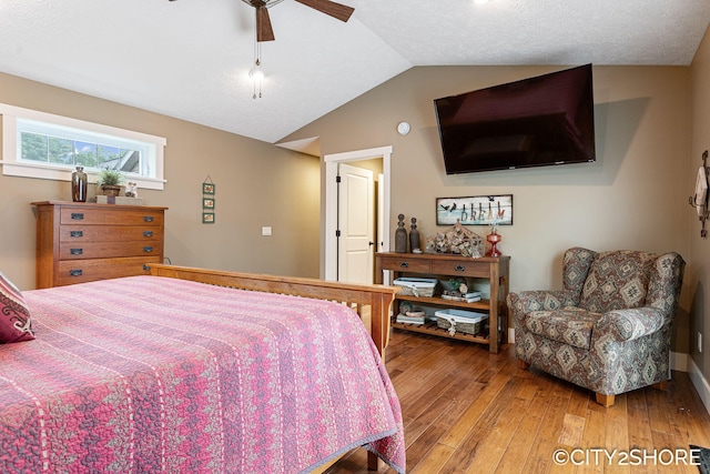3981 Acadia Dr, Hudsonville, MI 49426 - bedroom featuring hardwood / wood-style flooring, vaulted ceiling, and a ceiling fan