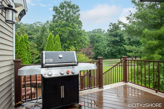 3981 Acadia Dr, Hudsonville, MI 49426 - wooden deck with a grill, a lawn, and a forest view