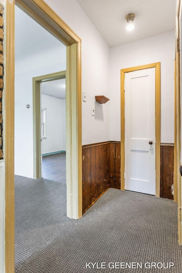 747 State St, Holland, MI 49423 - hallway with carpet, wainscoting, and wooden walls