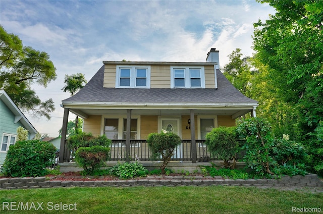 619 Frank St, Flint, MI 48504 - bungalow-style house with covered porch, roof with shingles, a front lawn, and a chimney