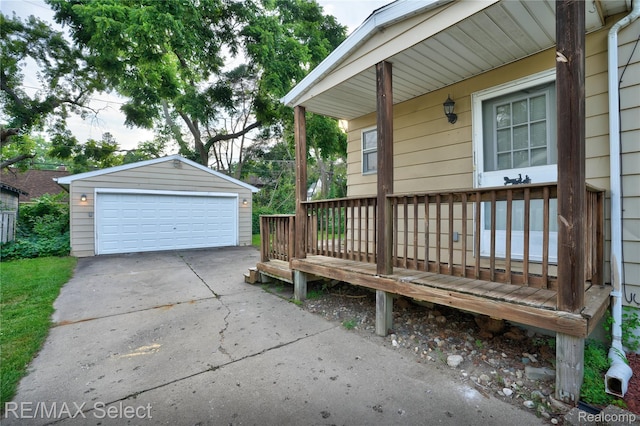 619 Frank St, Flint, MI 48504 - wooden deck with a detached garage and an outdoor structure