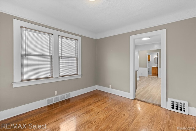 619 Frank St, Flint, MI 48504 - unfurnished room featuring light wood finished floors and baseboards