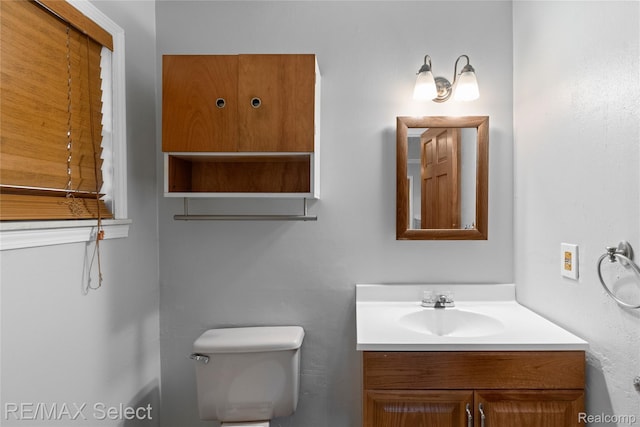 619 Frank St, Flint, MI 48504 - bathroom with vanity and toilet