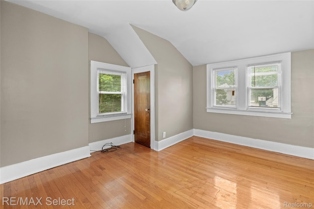 619 Frank St, Flint, MI 48504 - bonus room featuring lofted ceiling, light wood-style floors, and healthy amount of natural light