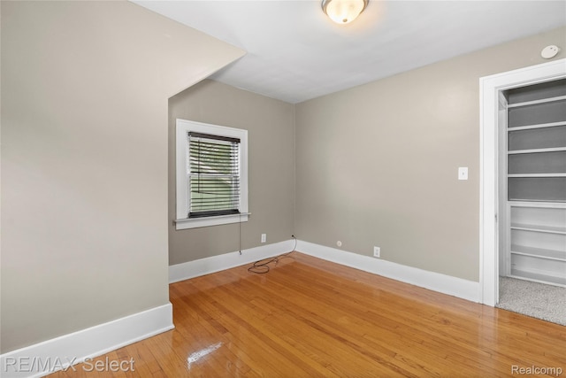 619 Frank St, Flint, MI 48504 - spare room featuring hardwood / wood-style flooring and built in shelves