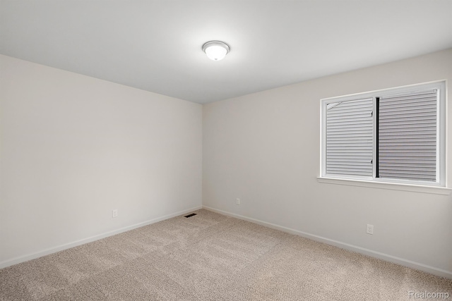 21008 Campolina Dr, South Lyon, MI 48178 - empty room featuring light carpet and baseboards