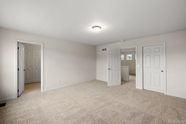 21008 Campolina Dr, South Lyon, MI 48178 - unfurnished bedroom featuring light carpet and baseboards