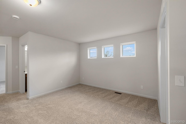 21008 Campolina Dr, South Lyon, MI 48178 - empty room featuring light colored carpet and a smoke detector