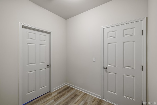 21008 Campolina Dr, South Lyon, MI 48178 - interior space featuring light wood-style flooring and baseboards