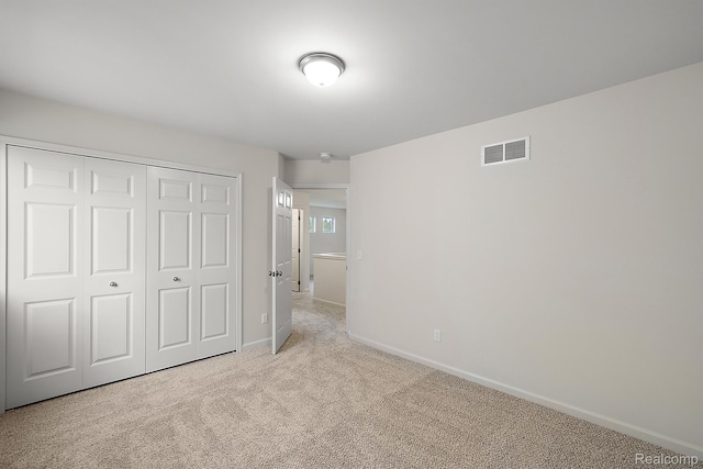 21008 Campolina Dr, South Lyon, MI 48178 - unfurnished bedroom with light carpet and a closet