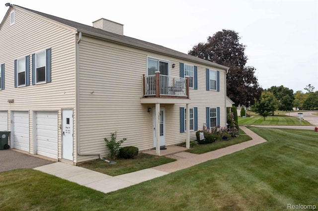 3091 Oakridge Ct, Lake Orion, MI 48360 - view of front of property with a balcony, a front yard, a chimney, and an attached garage