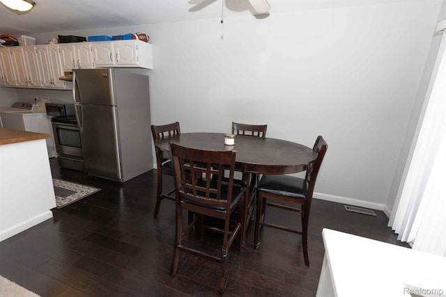 3091 Oakridge Ct, Lake Orion, MI 48360 - dining area with washer and clothes dryer, a ceiling fan, and dark wood-style floors