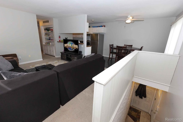 3091 Oakridge Ct, Lake Orion, MI 48360 - living area with ceiling fan and light carpet