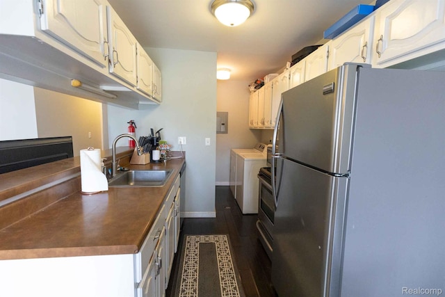 3091 Oakridge Ct, Lake Orion, MI 48360 - kitchen featuring appliances with stainless steel finishes, washing machine and clothes dryer, white cabinets, and dark wood-type flooring
