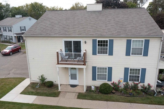 3091 Oakridge Ct, Lake Orion, MI 48360 - view of front of home with a balcony and a shingled roof