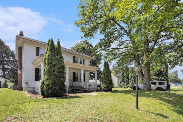1615 W Genesee St, Lapeer, MI 48446 - view of front facade featuring a porch, a front yard, and a chimney