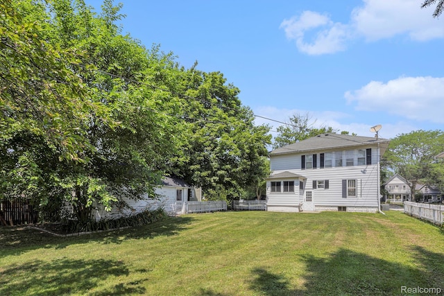 1615 W Genesee St, Lapeer, MI 48446 - rear view of house featuring a fenced backyard