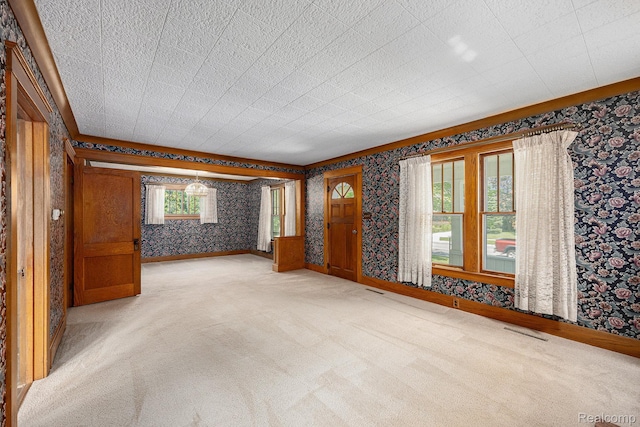 1615 W Genesee St, Lapeer, MI 48446 - spare room with wallpapered walls and carpet flooring