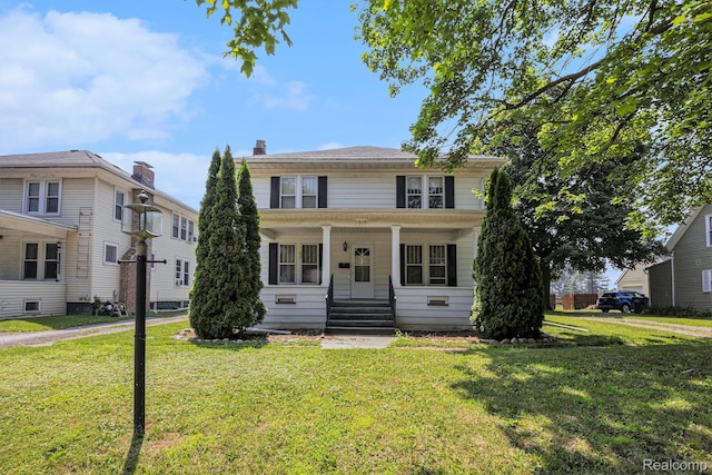 1615 W Genesee St, Lapeer, MI 48446 - american foursquare style home with a front lawn and a porch