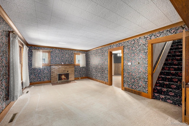 1615 W Genesee St, Lapeer, MI 48446 - unfurnished living room with carpet floors, a fireplace, wallpapered walls, stairway, and crown molding