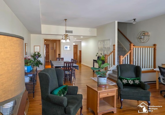 8 E Front St, Monroe, MI 48161 - living room featuring stairs and wood finished floors