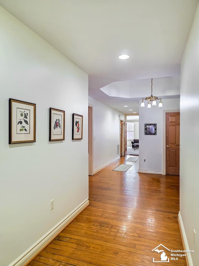 8 E Front St, Monroe, MI 48161 - hall featuring light wood finished floors, recessed lighting, and a chandelier