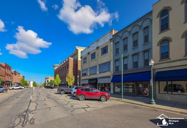 8 E Front St, Monroe, MI 48161 - view of property featuring uncovered parking