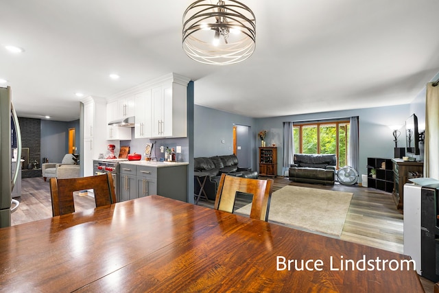 15520 157th Ave, Big Rapids, MI 49307 - dining space featuring wood finished floors, a chandelier, and recessed lighting