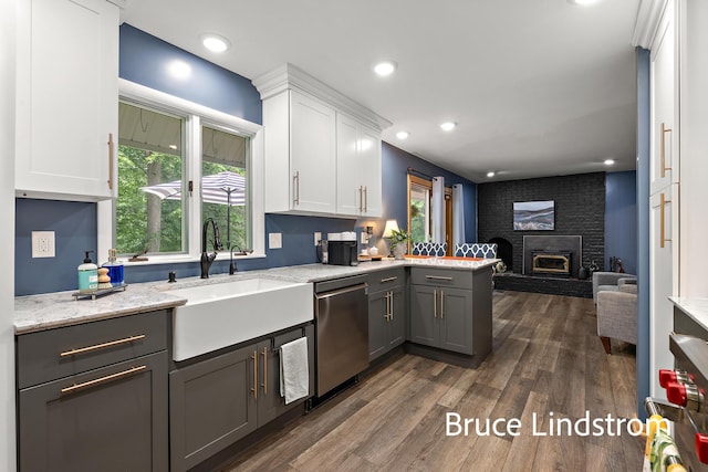 15520 157th Ave, Big Rapids, MI 49307 - kitchen with dishwasher, open floor plan, white cabinetry, gray cabinets, and a fireplace
