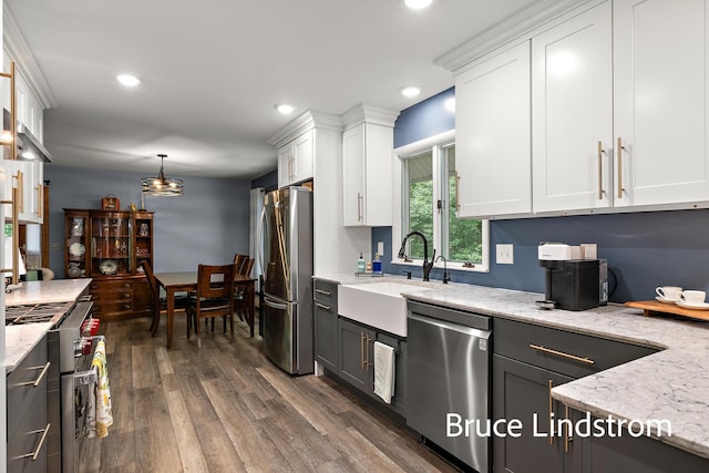 15520 157th Ave, Big Rapids, MI 49307 - kitchen with stainless steel appliances, white cabinetry, dark wood-style flooring, light stone countertops, and recessed lighting