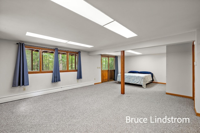 15520 157th Ave, Big Rapids, MI 49307 - unfurnished bedroom featuring a baseboard heating unit and carpet flooring