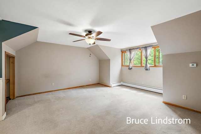 15520 157th Ave, Big Rapids, MI 49307 - additional living space featuring a baseboard radiator, ceiling fan, vaulted ceiling, and carpet floors
