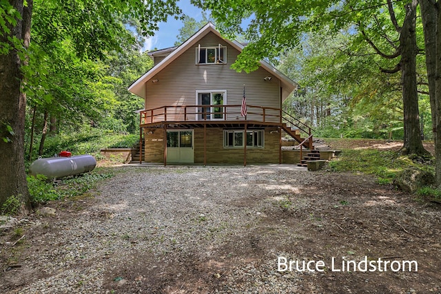 15520 157th Ave, Big Rapids, MI 49307 - rear view of house featuring stairs and a wooden deck