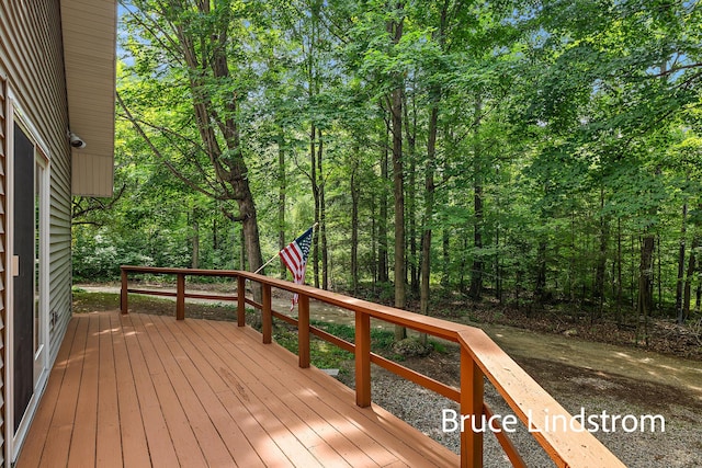 15520 157th Ave, Big Rapids, MI 49307 - wooden terrace featuring a wooded view