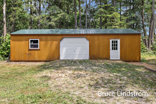 15520 157th Ave, Big Rapids, MI 49307 - garage featuring view of scattered trees
