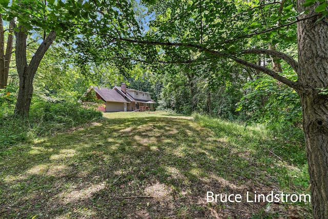 15520 157th Ave, Big Rapids, MI 49307 - view of grassy yard with a view of trees